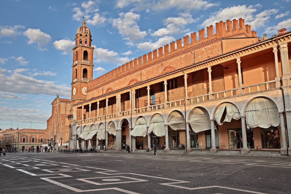 etailed brickwork and arches of historic buildings in Faenza, Emilia-Romagna
