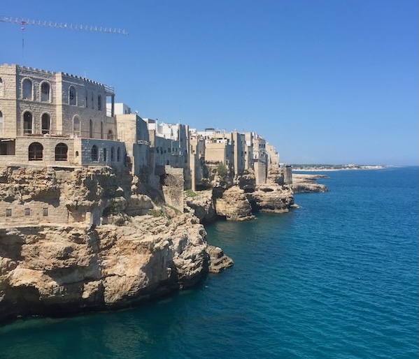 Dramatic cliffs of Polignano a Mare overlooking the turquoise Adriatic Sea