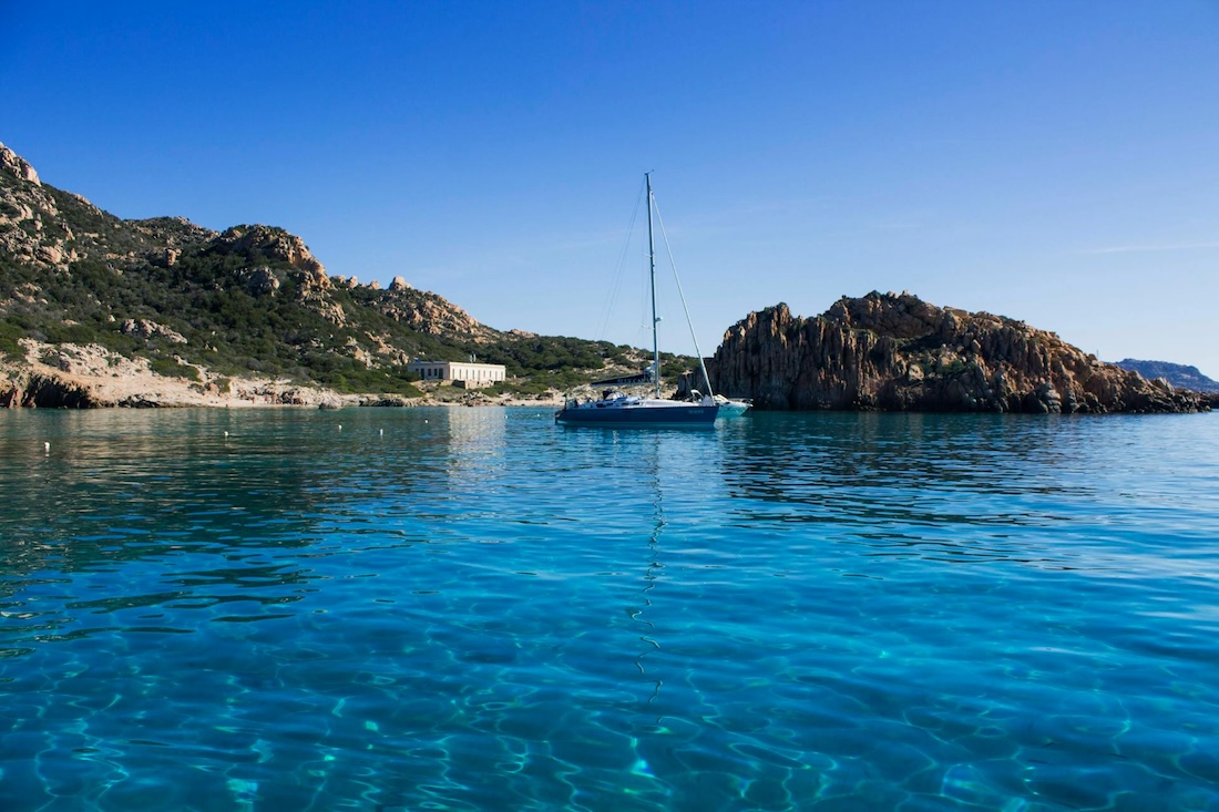 View of a sailboat in clear water, Sardinia