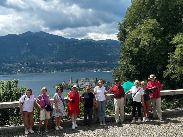 Guests on our 2026 Italian Lakes small group tour overlooking Isola San Giulio on Lake Orta.